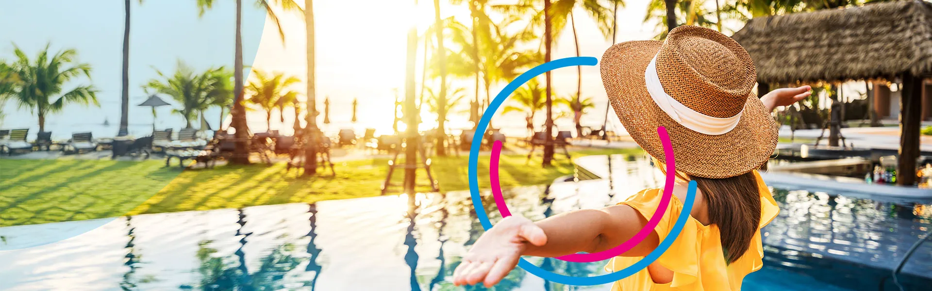 Person open their arms looking at a resort with pool and palm trees