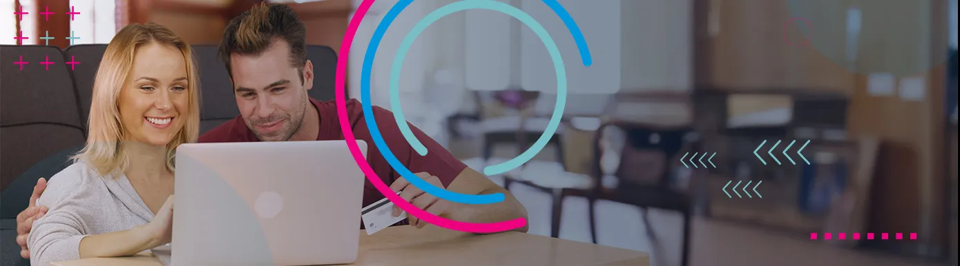 A couple viewing a laptop in a cafe