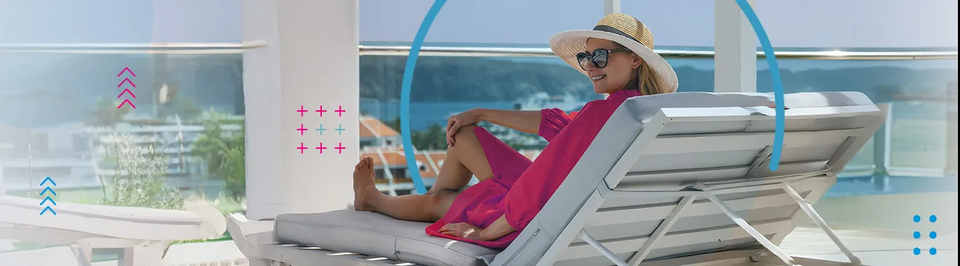 A lady on a deck chair by the pool
