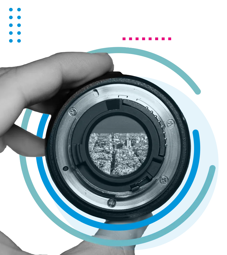 Camera optics with a city in focus