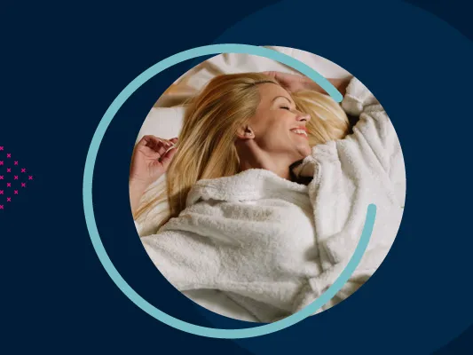 A blue background with the text HBX GROUP and a circular image of a woman laying on a bed in a towel robe