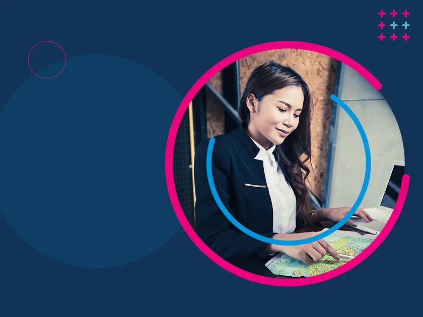 A blue background with a circular image of a travel agent at their desk